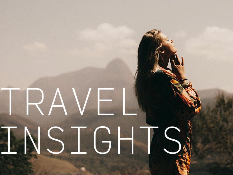 A peaceful woman with a scenic mountain background and the caption "Travel Insights".